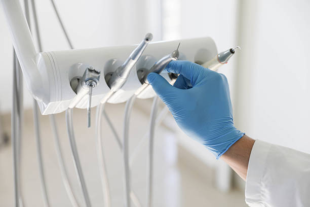 Professional Tooth Extraction technician working in Dellwood, MN